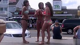 Three cuties with big asses on the boardwalk