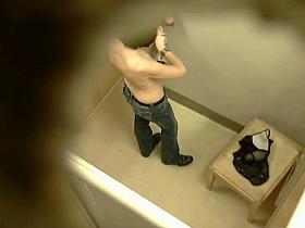 Topless tattooed asian babe caught by changing room spy cam