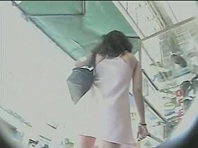 Horny babe in cool dress gets filmed by a shameless voyeur