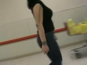 Eye-catching candid of a brunette peach walking around the city