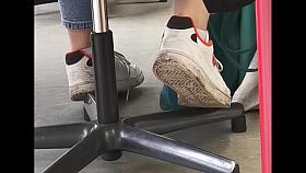 candid feet in white ankle socks and sneakers