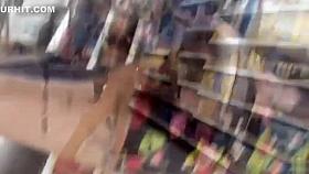 Slim daring girl spreads firm butt cheeks in the supermarket