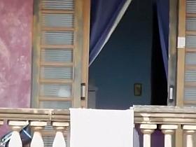 Neighbor in black underwear cleaning