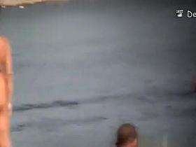 Voyeur at beach films nudists