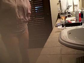 Mature wife spied in bathroom smoking and drinking