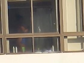 Ebony spied through her apartment window