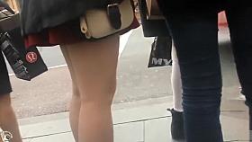 Lovely legs on a coed in a red skirt