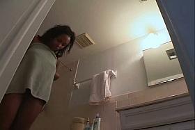 Sexy black girl caught nude in her own bathroom by a spy cam