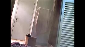 Girl is taking her clothes off in a change room