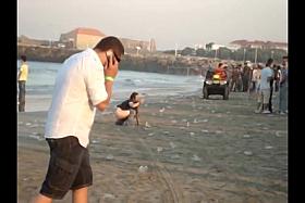A fresh boozed girl pissing in public on the beach