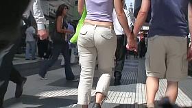Sexy brunette with nice tits, a nicer ass on a sidewalk candid vid