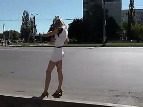 Hypnotic ass under a short white skirt