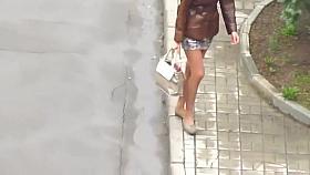 Sexy girl flashing her stocking tops. (3 of 3)