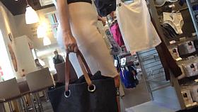 Sexy blonde milf in a store