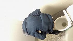 Russian girls in winter clothes gets taped while peeing in the street toilet