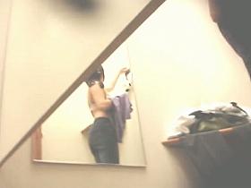 Leggy dressing room girl choosing a sexy bra to buy