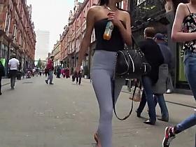 Black thong peeks thru grey leggings