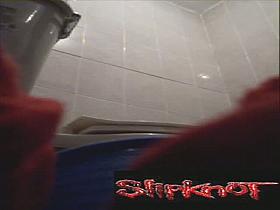 A woman takes a sensual piss while filmed by a hidden video camera