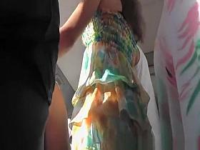Chick in colorful dress bus upskirt