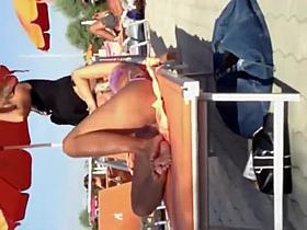 Milf lying by the pool and touching pussy