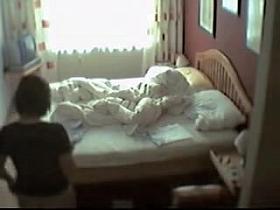 Pantieless girl masturbating pussy slit on the bed