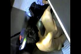 Spying on couple in the cubicle