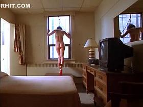 Kinky lady in latex dress does a naughty dance