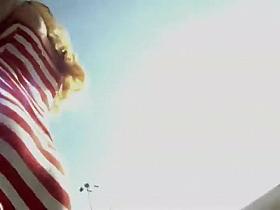 Tattoed butt under a striped skirt