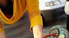 Street market seller has her big cleavage caught on the camera