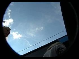 Bimbo blonde with white panties gets on a bus in an upskirt porno