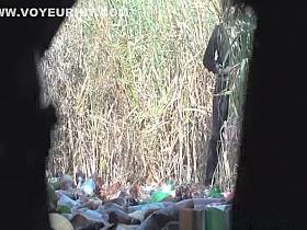 Woman squats and pee outdoors