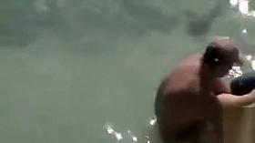 Voyeur doggystyle sex with couple in the ocean