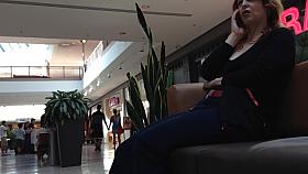Mature woman sitting on mall bench