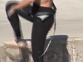 Girl is wearing wet spandex pants on her candid long legs 03e