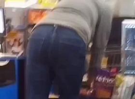 Sexy ass on brunnete milf in jeans at self checkout