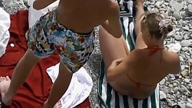 Naked Couple Playing On The Beach