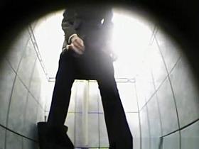 Woman squats and pees in toilet