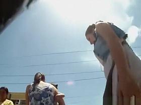 Girl grabs her short dress upskirt