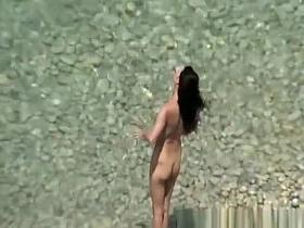 Hot woman sunbathing in beach