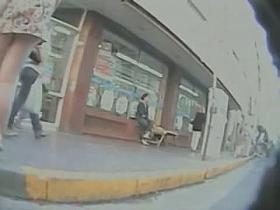 Gorgeous hussy likes us to see her upskirt walk on the street