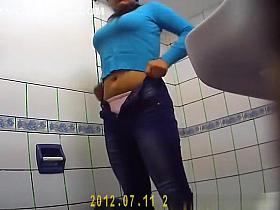 Girl with glasses takes a pee