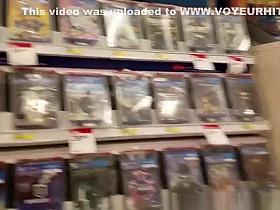 Girl in gray leggings at the electronics store