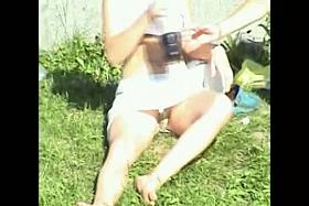 Adorable sport babe resting on the grass with sexy upskirt view