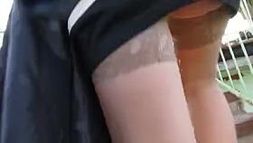 Girl in stockings going upstairs