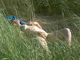 Lady in the dunes on a North Devon beach