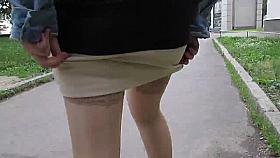 Flashing stockings tops on a stair