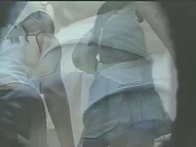 Upskirt voyeur follows a cute blonde with a perky butt