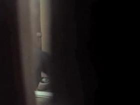 Girl is getting dressed and voyeured through curtains