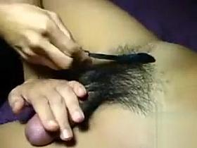 Giving a shave to the fully erected pecker