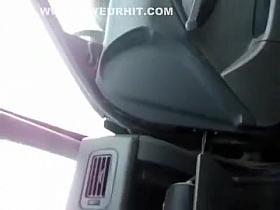 Chubby chick urinates on the ground outside the car